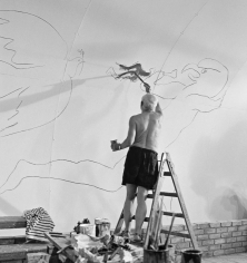 Edward Quinn, Pablo Picasso working on the “War and Peace Study” Drawings on the wall of Chapelle de la Paix for the documentary film of Luciano Emmer, Vallauris, 1953