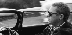 Sid Avery, Steve McQueen driving his 1957 XK-SS Jaguar through Nichols Canyon in Hollywood, 1960