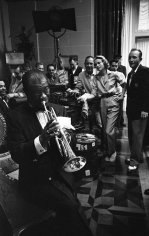 Bob Willoughby, Grace Kelly, Bing Crosby, and crew are treated to an impromptu concert by Louis Armstrong on the MGM set of “High Society”, 1956