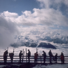 Slim Aarons, Verbier View: Skiers admire the view across a valley of clouds at Verbier, 1964