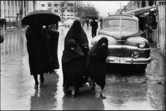 Inge Morath, Veiled women and girls struggling through heavy rain, Tehran, Iran, 1956