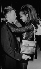 Ron Galella, David Bowie and Iman at "7th On Sale", a gala fundraising benefit for AIDS at the 69th Regiment Armory, New York, 1990