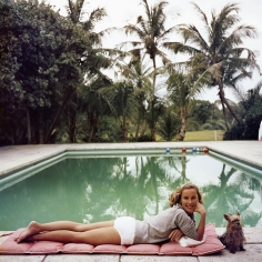 Slim Aarons, Having a Topping Time, 1959: Socialite Alice Topping relaxing poolside in Palm Beach